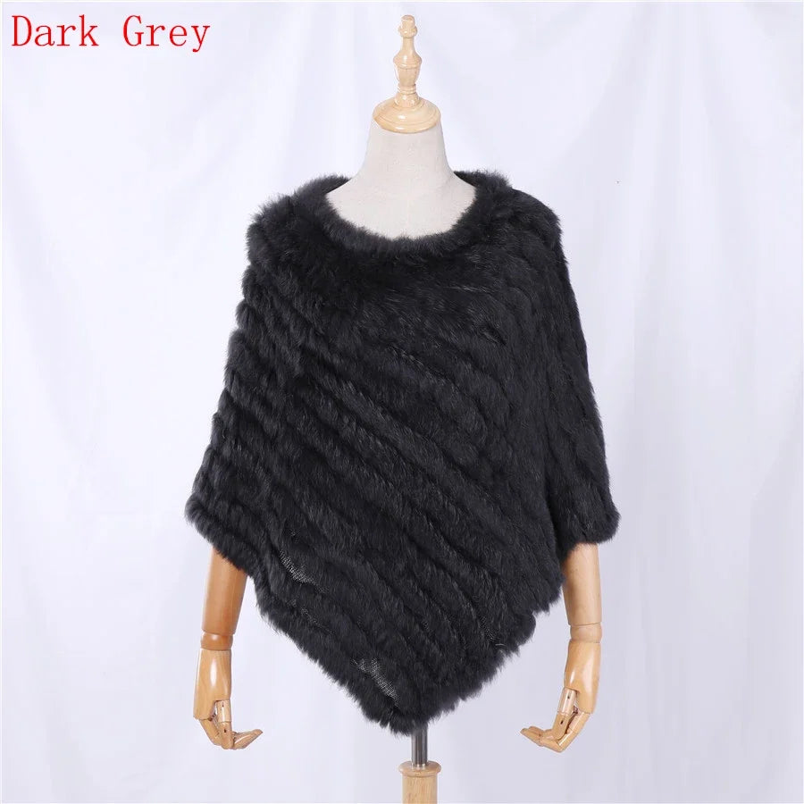 Soft faux-fur-look poncho with short sleeves, a round neckline, and an asymmetrical hem