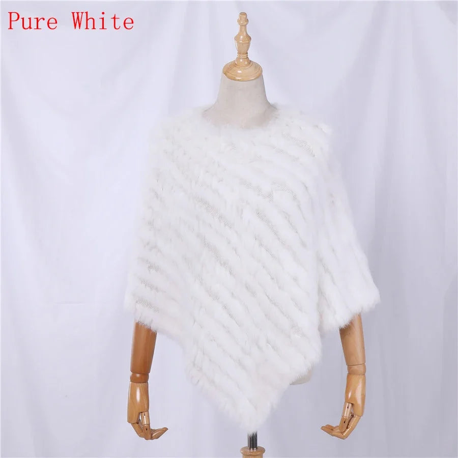Soft faux-fur-look poncho with short sleeves, a round neckline, and an asymmetrical hem