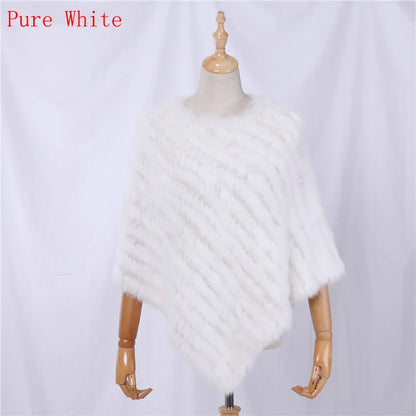Soft faux-fur-look poncho with short sleeves, a round neckline, and an asymmetrical hem