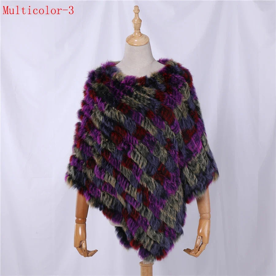 Soft faux-fur-look poncho with short sleeves, a round neckline, and an asymmetrical hem
