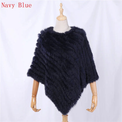 Soft faux-fur-look poncho with short sleeves, a round neckline, and an asymmetrical hem