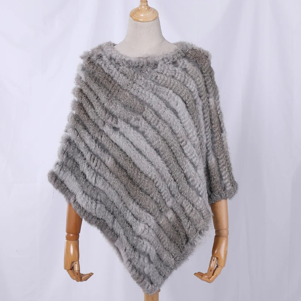 Soft faux-fur-look poncho with short sleeves, a round neckline, and an asymmetrical hem