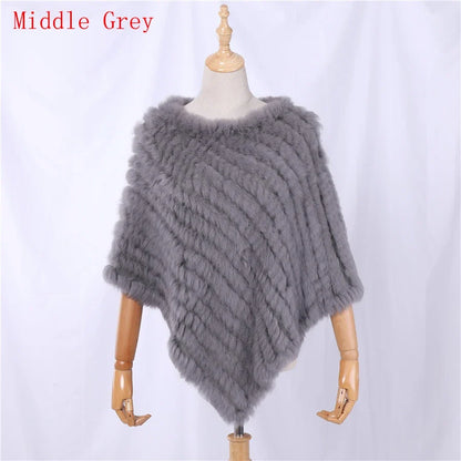Soft faux-fur-look poncho with short sleeves, a round neckline, and an asymmetrical hem