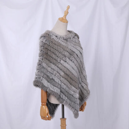Soft faux-fur-look poncho with short sleeves, a round neckline, and an asymmetrical hem