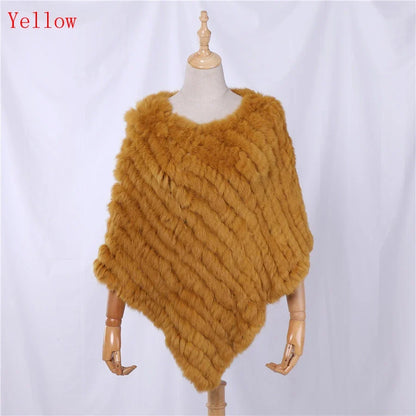 Soft faux-fur-look poncho with short sleeves, a round neckline, and an asymmetrical hem