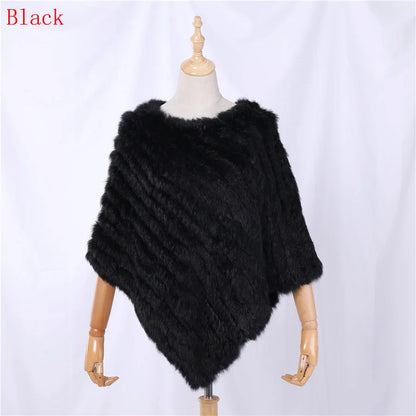 Soft faux-fur-look poncho with short sleeves, a round neckline, and an asymmetrical hem