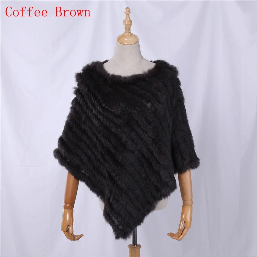 Soft faux-fur-look poncho with short sleeves, a round neckline, and an asymmetrical hem
