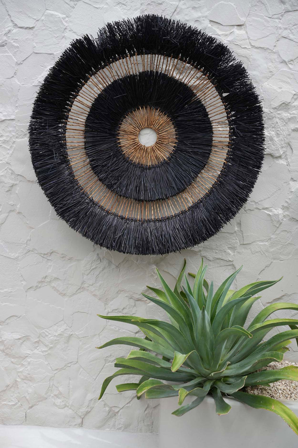 Wanddecoratie bananenblad Maurea boho zwart – Ø 110 cm, handgevlochten, rond