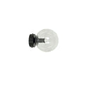 Zwarte wandlamp met ronde transparante glazen kap en zichtbare lamp op een ronde zwarte wandplaat