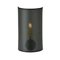Zwarte wandlamp met halfronde geperforeerde stoffen kap waar het warme licht van de lamp doorheen schijnt