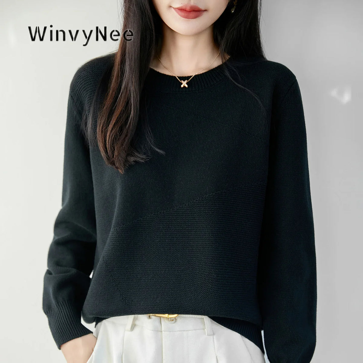 Women's crew-neck long-sleeve knit sweater with textured details