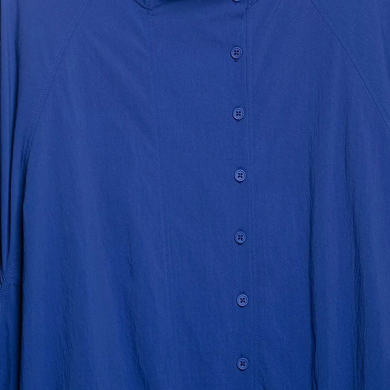 Blue women's blouse with stand-up collar and drawstring hem