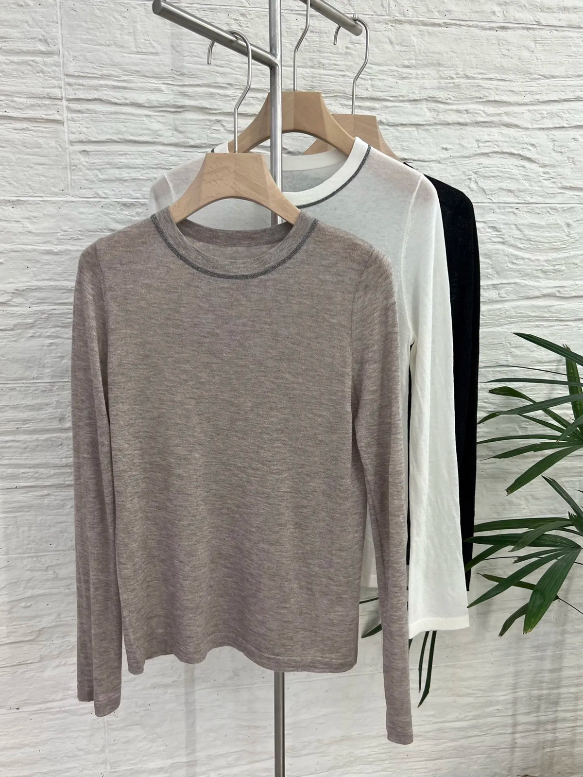 Crew-neck long-sleeve top with contrast stitching, slightly sheer fabric