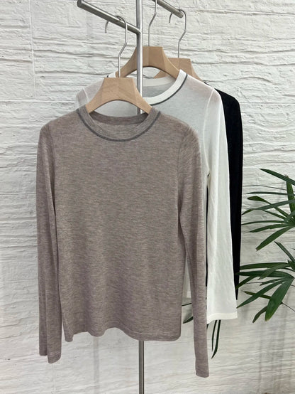 Crew-neck long-sleeve top with contrast stitching, slightly sheer fabric