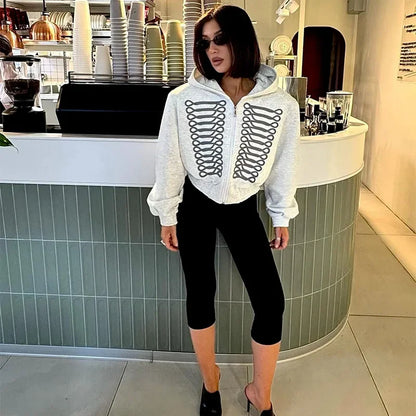 Short women's hoodie with zipper and decorative trims