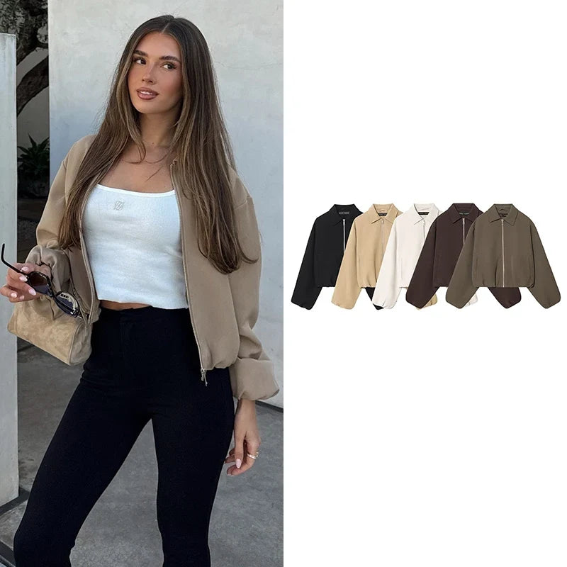 Short women's bomber jacket with collar, zipper, and long sleeves