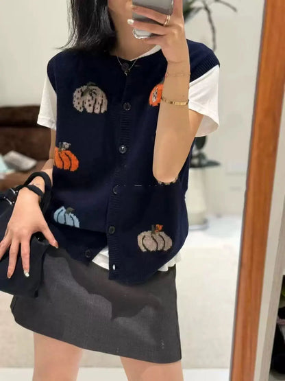 Women's knitted vest with pumpkin motifs, button placket, and round neckline