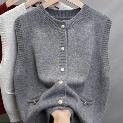 Women's knitted vest with crew neck, button placket, and pockets