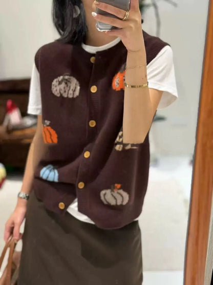 Women's knitted vest with pumpkin motifs, button placket, and round neckline