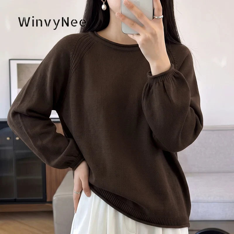Women's crew-neck long-sleeve knit sweater with raglan sleeves and cuffs