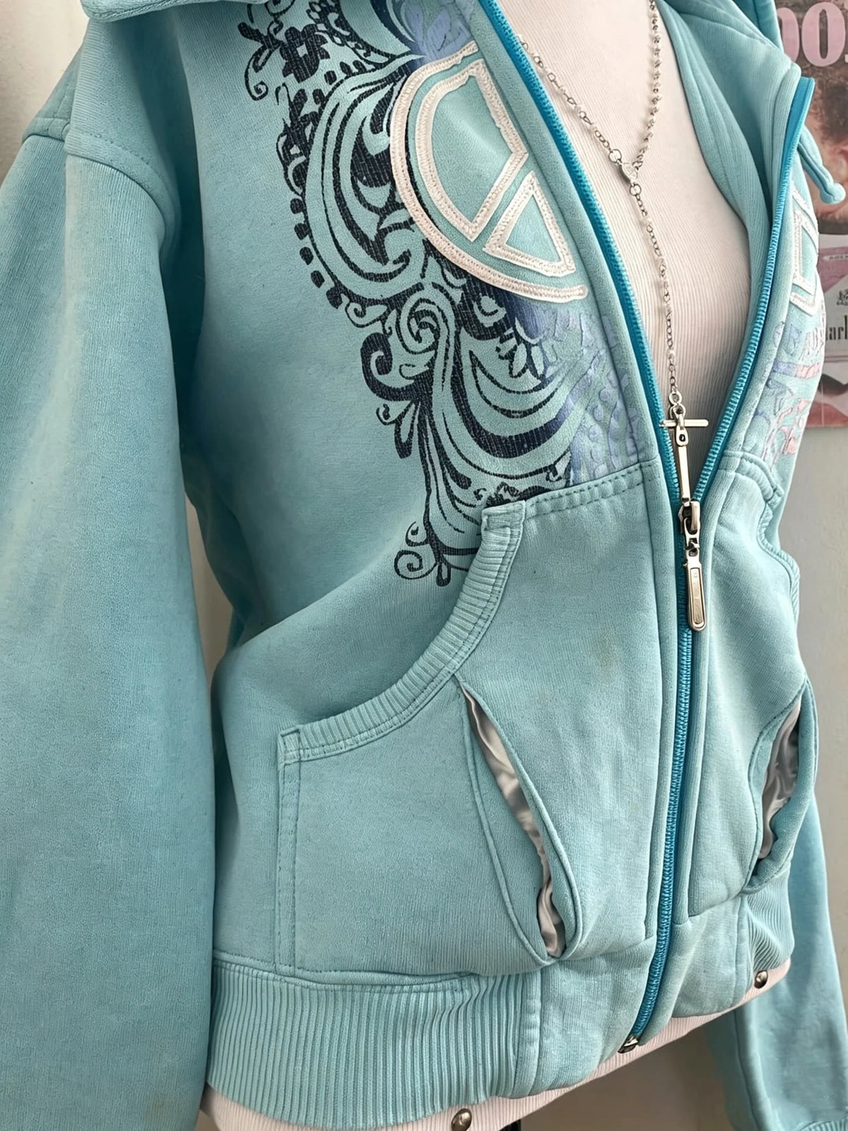 Women's turquoise hoodie with zipper and graphic print