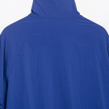 Blue women's blouse with stand-up collar and drawstring hem