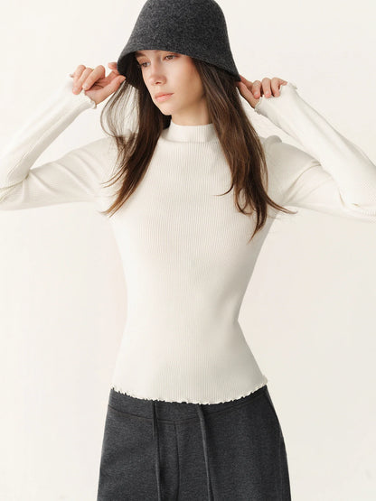 Women's ribbed long-sleeve top with stand collar and ruffled hem
