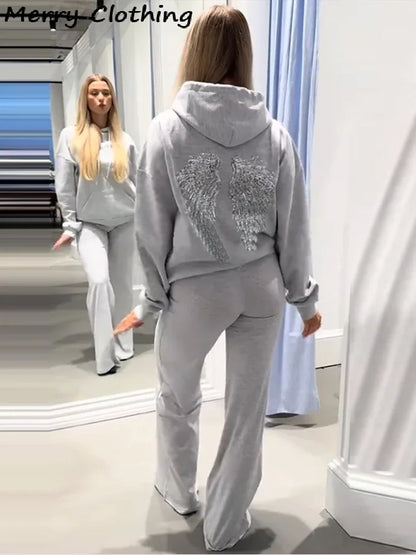 Long-sleeved hoodie with sequin wing motif on the back