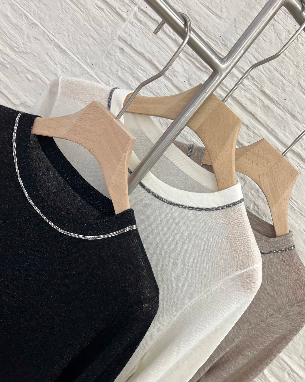 Crew-neck long-sleeve top with contrast stitching, slightly sheer fabric
