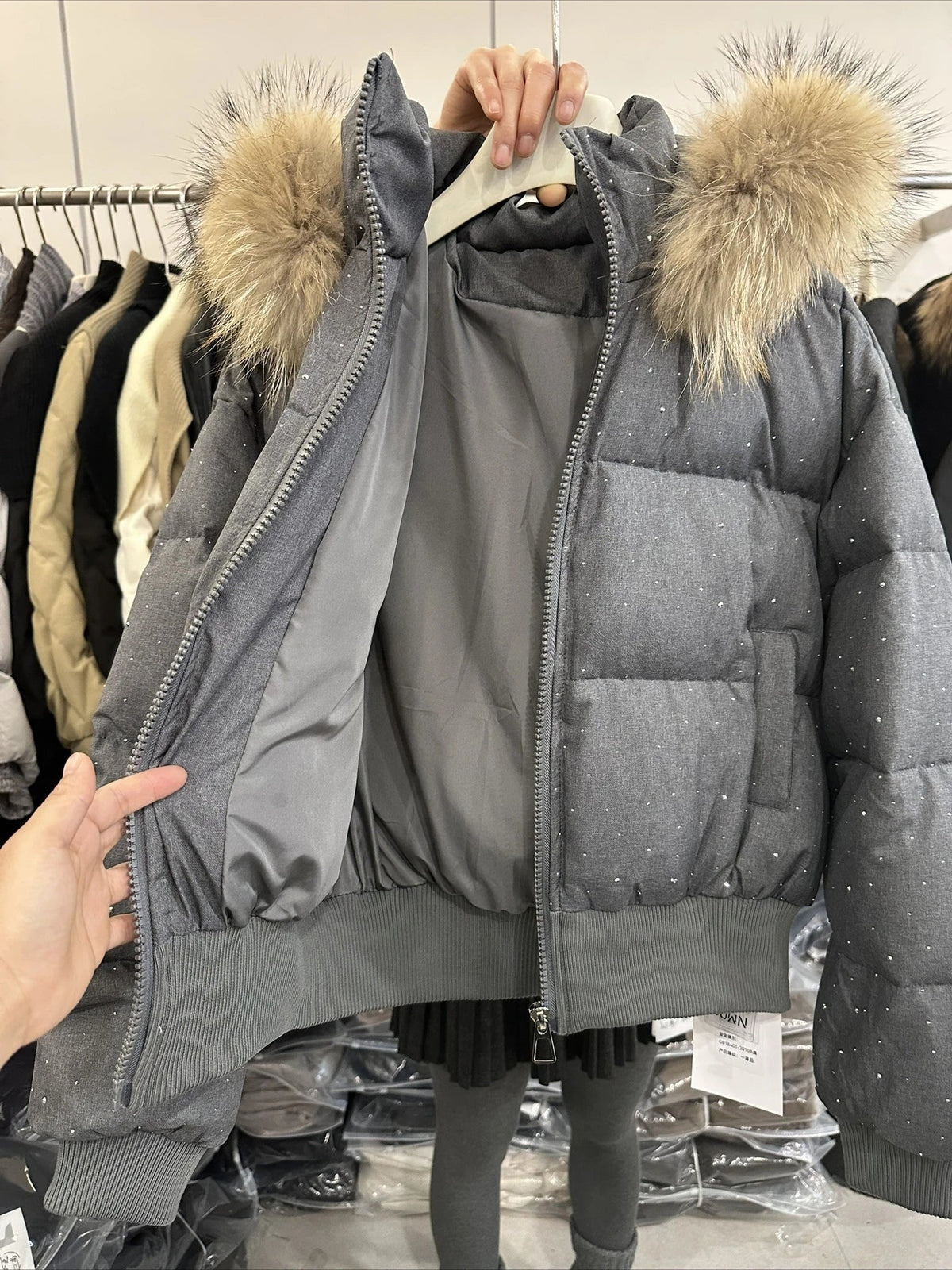 Women's quilted jacket with faux-fur hood and glitter details