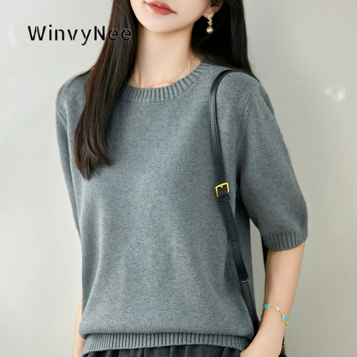 Women's short-sleeve crew-neck knit sweater with ribbed cuffs