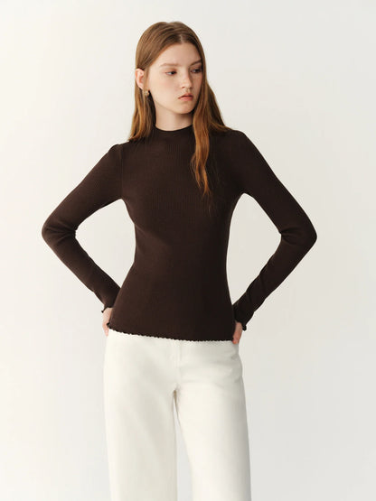 Women's ribbed long-sleeve top with stand collar and ruffled hem