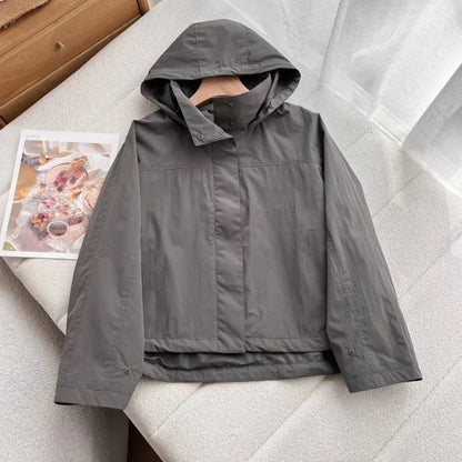 Short women's transitional jacket with hood and stand-up collar