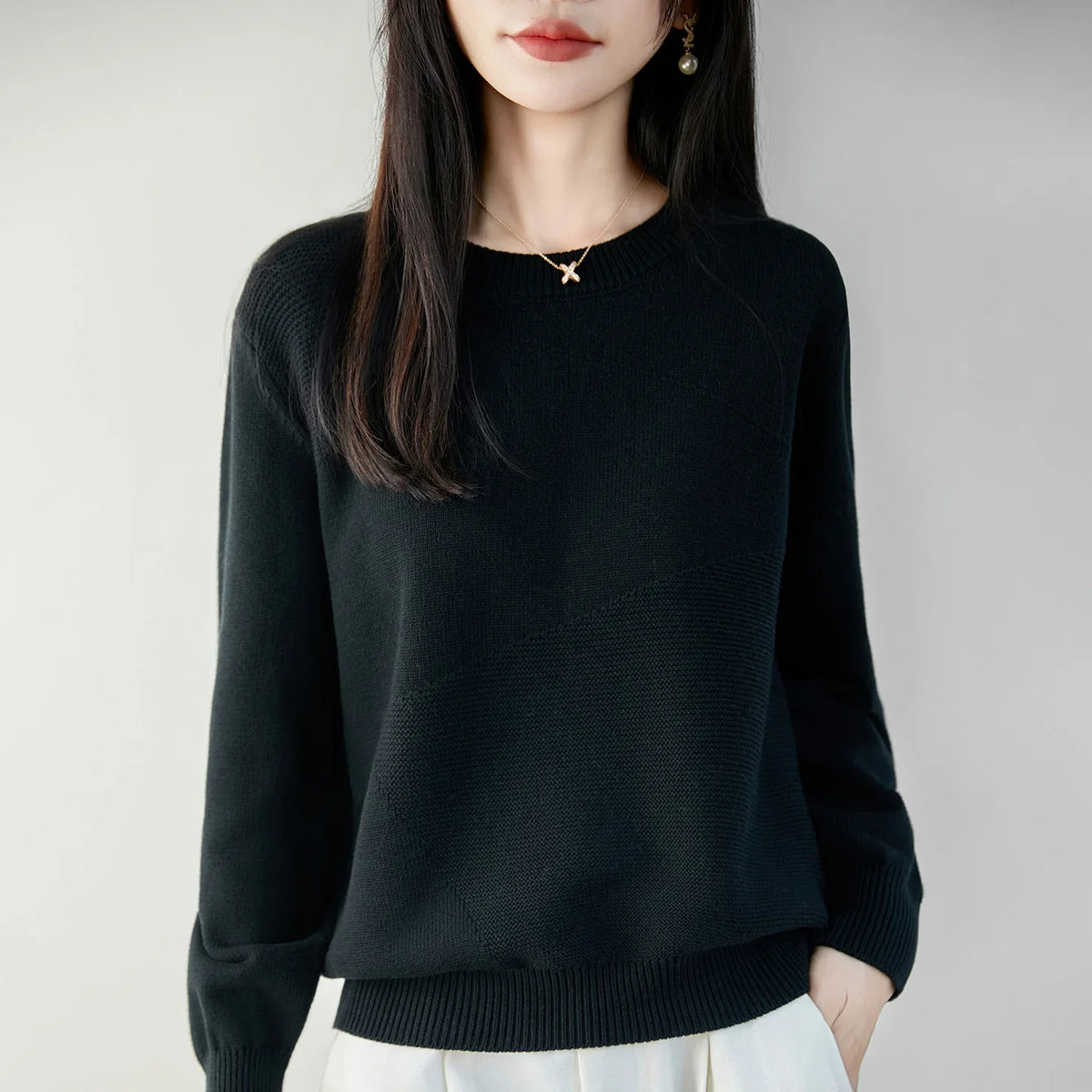 Women's crew-neck long-sleeve knit sweater with textured details