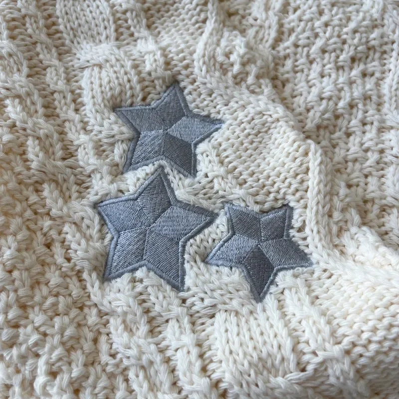 Strickjacke Damen V-Ausschnitt Zopfmuster Sterne Crèmeweiß