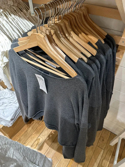 Women's cropped crew-neck long-sleeve pullover with raw edges