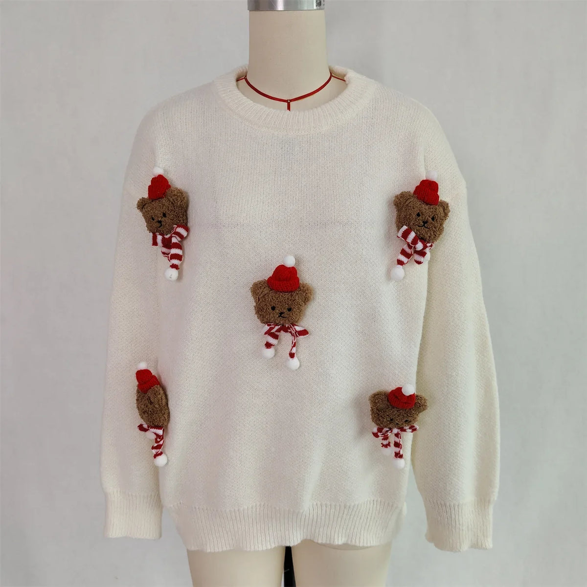 Red Christmas sweater with teddy bear appliqués and a crew neck