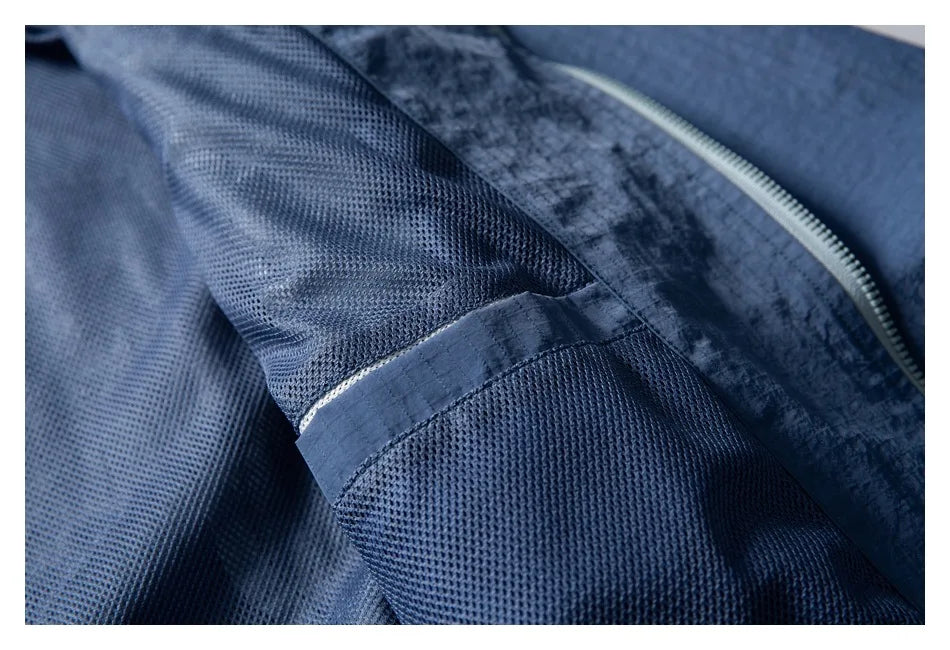 Unisex Leichte Kapuzenjacke Windbreaker mit Reißverschlusstasche