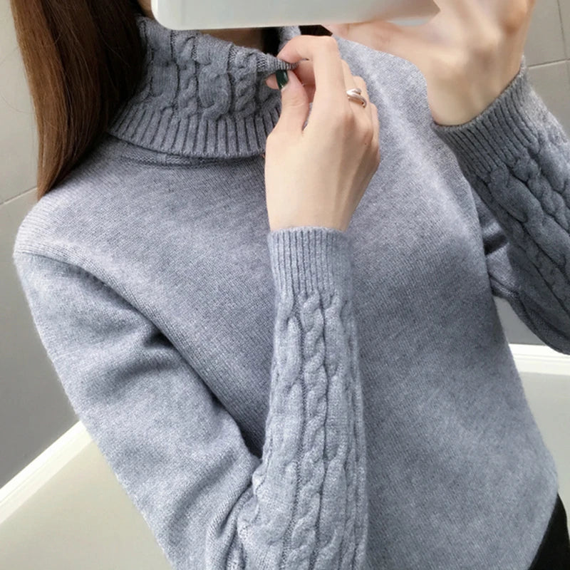 Women's turtleneck knitted sweater with cable-knit sleeves