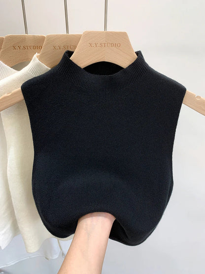 Ribbed knitted sleeveless top with stand collar