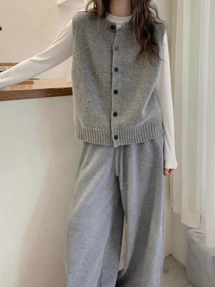 Women's knitted vest with button placket, round neckline, and rib-knit hem