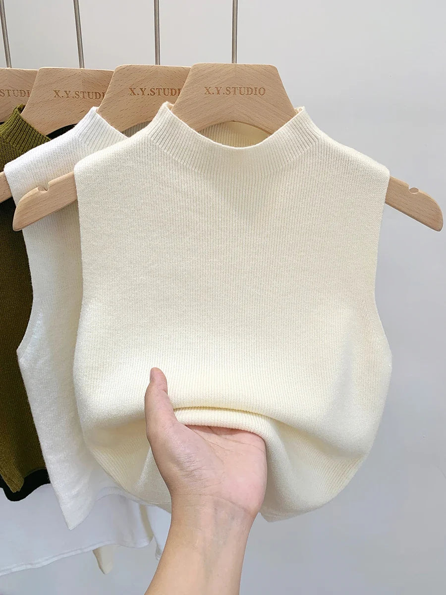 Ribbed knitted sleeveless top with stand collar