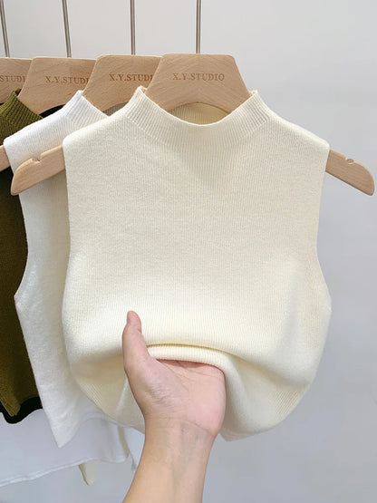 Ribbed knitted sleeveless top with stand collar