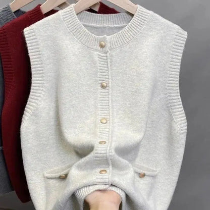Women's knitted vest with crew neck, button placket, and pockets