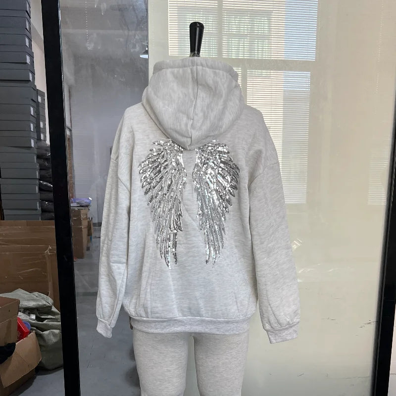 Long-sleeved hoodie with sequin wing motif on the back