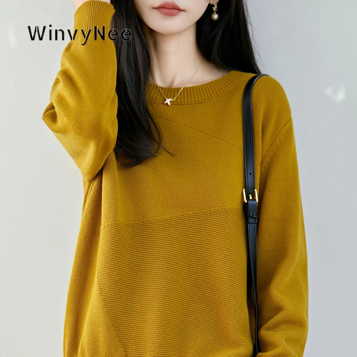 Women's crew-neck long-sleeve knit sweater with textured details