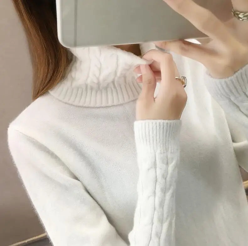 Women's turtleneck knitted sweater with cable-knit sleeves