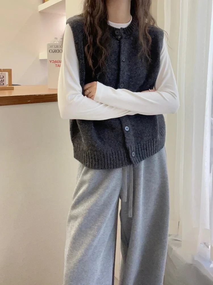 Women's knitted vest with button placket, round neckline, and rib-knit hem