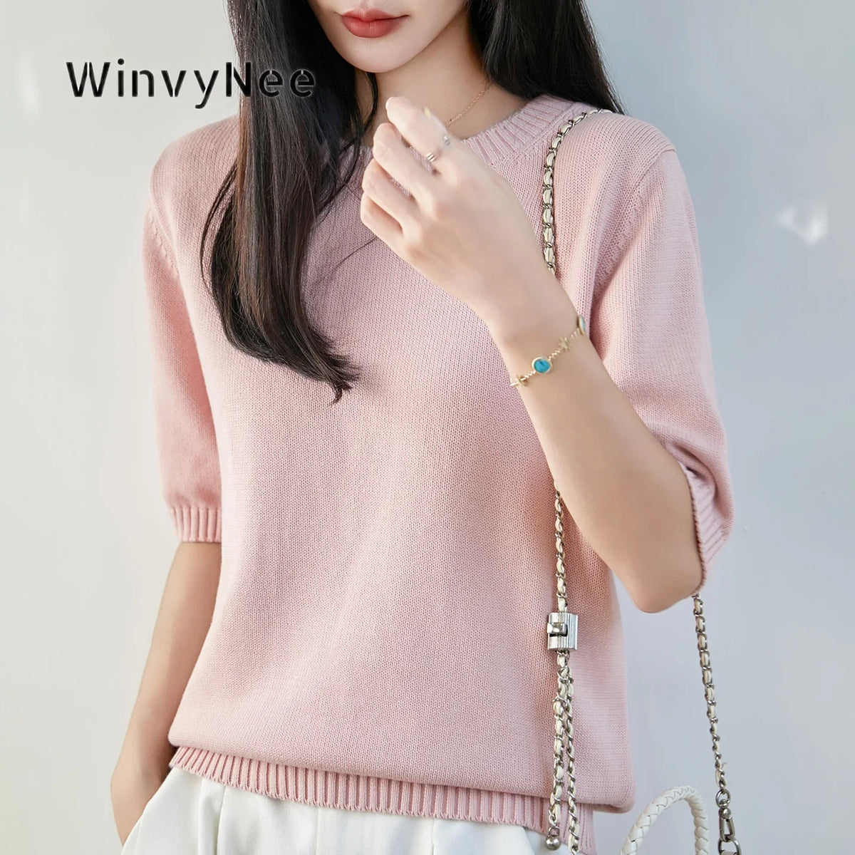 Women's short-sleeve crew-neck knit sweater with ribbed cuffs