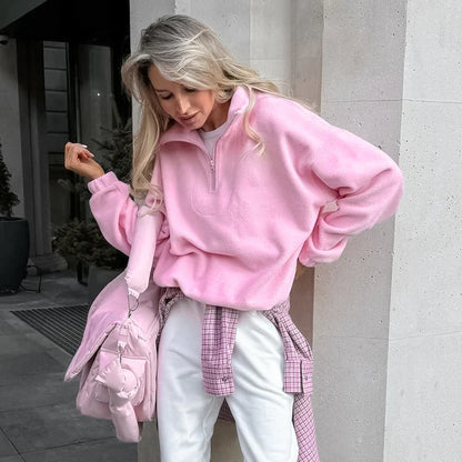 Women's pink fleece pullover with zip-up stand collar and long sleeves